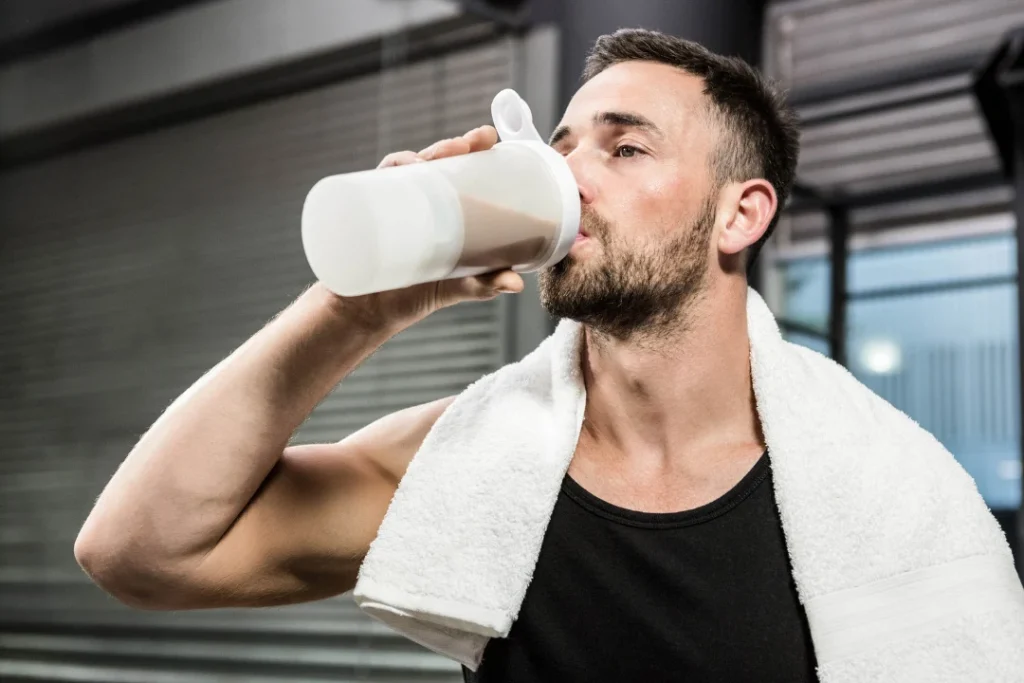 Man drinking protein shakes for energy. 