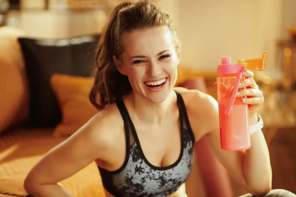 A lady enjoying protein drink. 